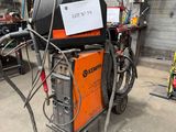 a machine that is sitting on the ground in the garage