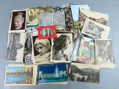 a pile of old postcards with pictures of people on them