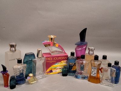 many different types of perfume bottles on a white surface