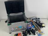 a box with fishing gear on a table next to a wall