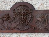 a plaque with a lion and flowers on it