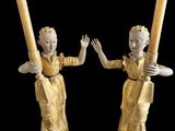 pair of antique carved wooden candlestick holders with figures holding candles