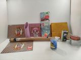 a white counter with a roll of paper and other crafting supplies on it