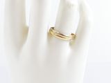 a close up of a person ' s hand with a ring on it