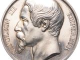 une vieille pièce d'argent sur laquelle est représenté le visage d'un homme
