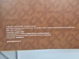 the back of a box with a picture of a person holding a cell phone
