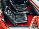 a red car with black seats in the back of it