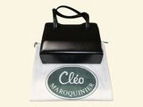 a black bag with a logo on it sitting on top of a white bag