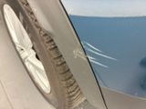 a close up of a car ' s tire with a sticker on it