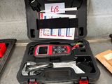 a tool case with tools in it sitting on the floor