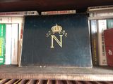 a book on a shelf with a crown on it