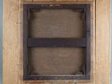 an old picture of a picture frame on a wall with a piece of wood