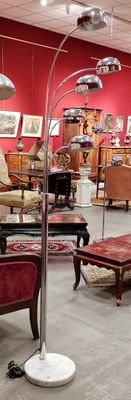 a room with a lot of furniture and a red wall