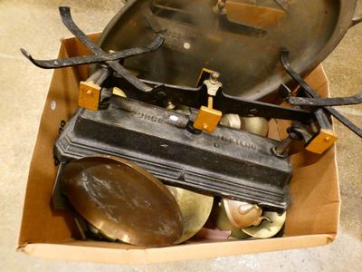 a box with a pan and a pair of scissors in it