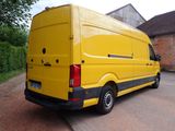 a yellow van parked on the side of the road