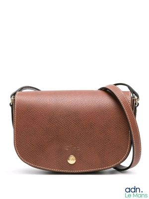 an image of a brown purse with a gold clasp