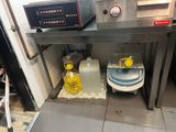 a picture of a commercial kitchen with a lot of food on the counter
