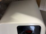 a white toaster sitting on top of a counter