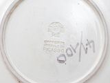 a white plate with a picture of a person on it
