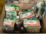 many bags of food in a box on the table