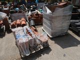 a large pile of bricks and other items on a pallet