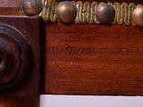 a close up of a wooden table with a clock on it