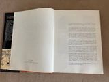 an open book with a picture of a cat on it