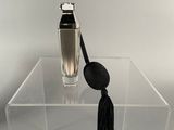 clear acrylic acrylic display case with a black tassel on top of it