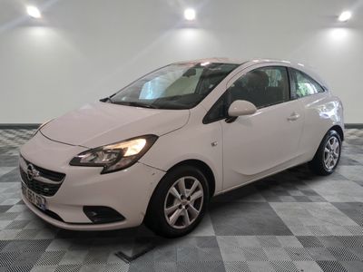 the white car is parked on a checkered floor in the garage