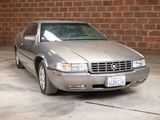 a silver car that is parked in a garage
