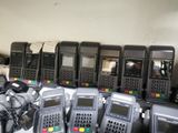 a lot of cell phones that are sitting on a table