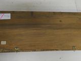 a close up of a piece of wood with a tag on it