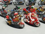 many figurines of different types of motorcycles on display