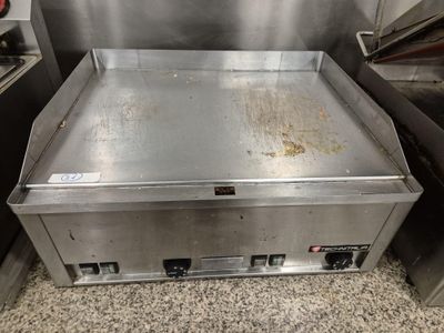 an image of a commercial gas griddle in a commercial kitchen