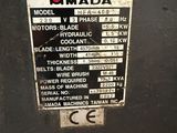 a sign on the side of a machine that says mada