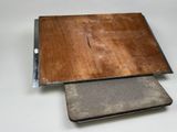 two pieces of wood that are laying on top of each other