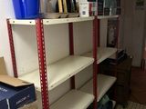 a room with a lot of boxes and boxes on the shelves