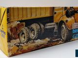 a yellow box with a picture of a dump truck on it