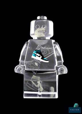 a lego man with a skateboard on a black background