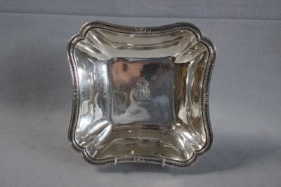 a silver plate that is sitting on a table