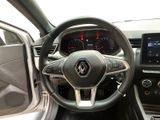 the interior of a car with a steering wheel and dashboard controls