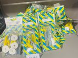 a pile of toilet paper and toilet paper rolls on a desk