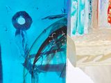 a close up of a glass vase with a blue liquid inside of it