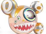 a very cute toy with a big smile on it ' s face