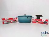 a blue pot sitting next to a box of soap