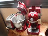 a red mixer and a blender sitting on a counter