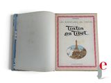 an open book with a picture of a tower on it