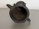 an image of a small metal object that is sitting on a table