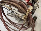 a motorcycle that has a bunch of hoses attached to it