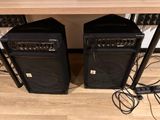 two speakers that are sitting on the floor next to each other